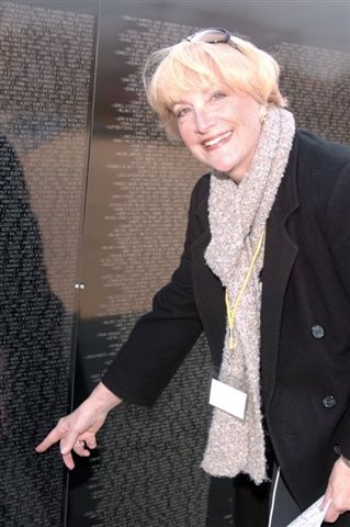Judi Quagliaroli at Vietnam wall. 
She is pointing to William Lee Sullivan (our classmate) name who died In Vietnam, July 4, 1970.
