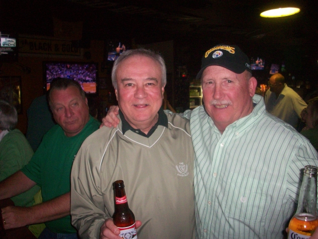 Tommy Fauls and Herb Schutt celebrating their birthday on St Patricks Day 2010 in Surfside Beach, SC. In left rear is Tommy Daniels (IHS 63).